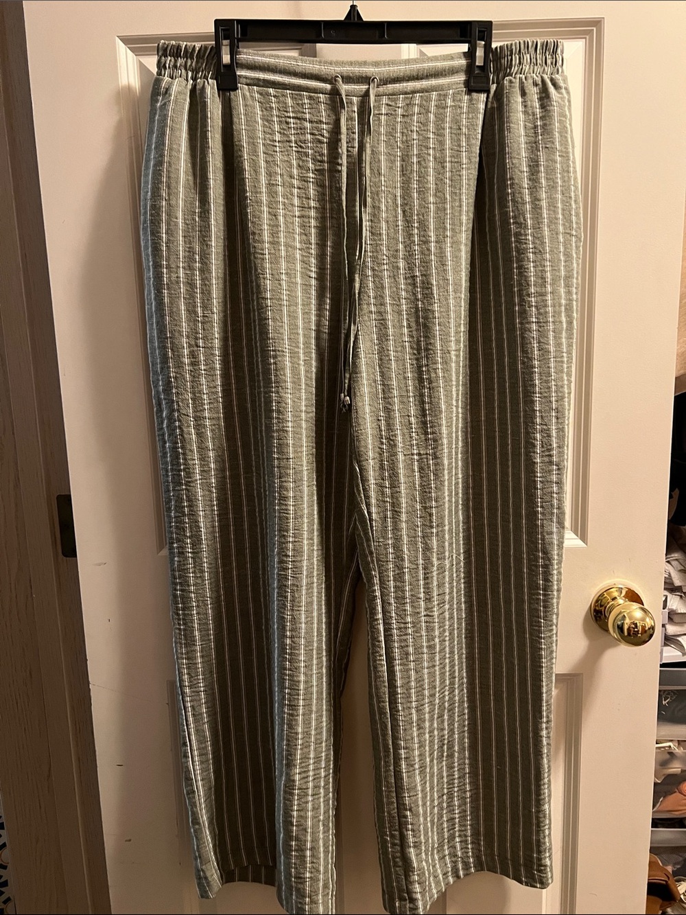Green and white striped trousers